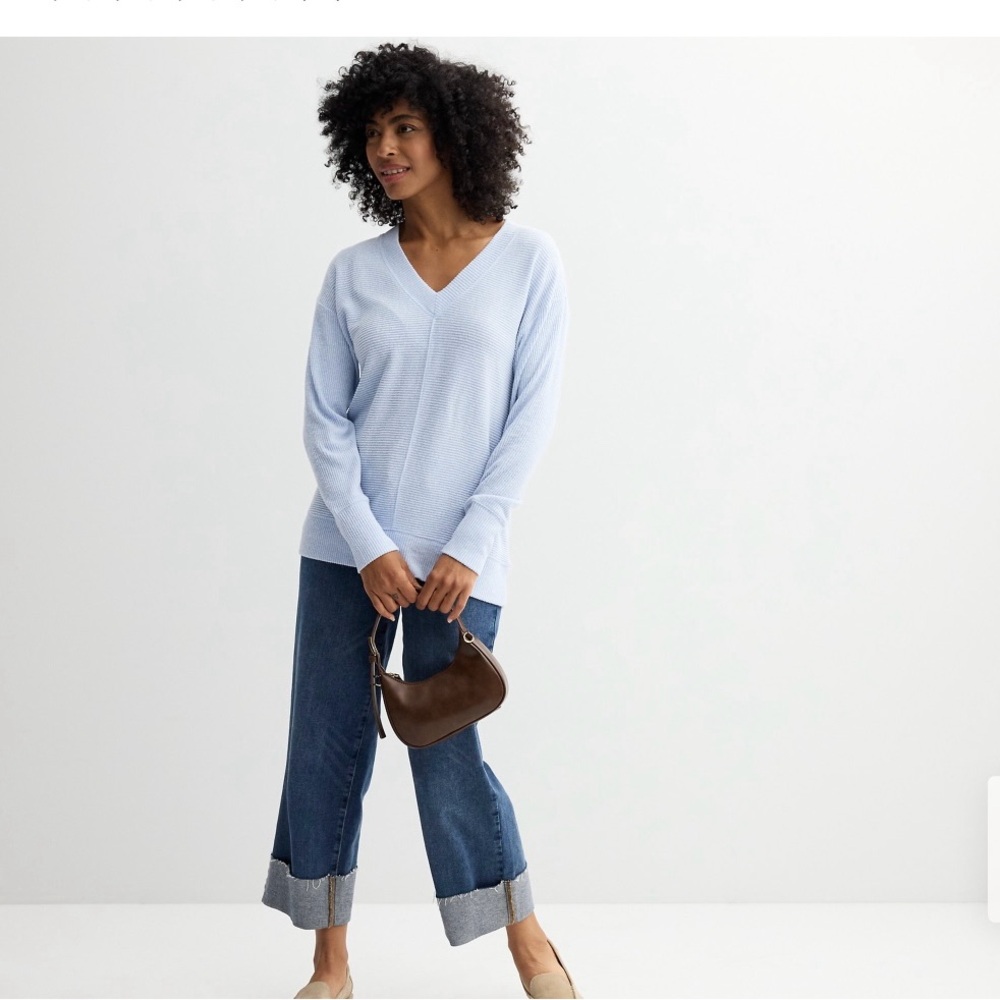 Beautiful light blue sweater.  NWT, medium.